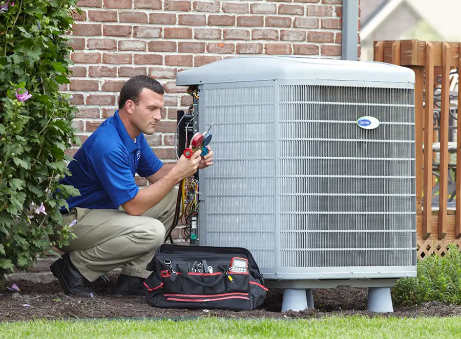 HVAC technician inspecting an outdoor air conditioning unit in Lehi